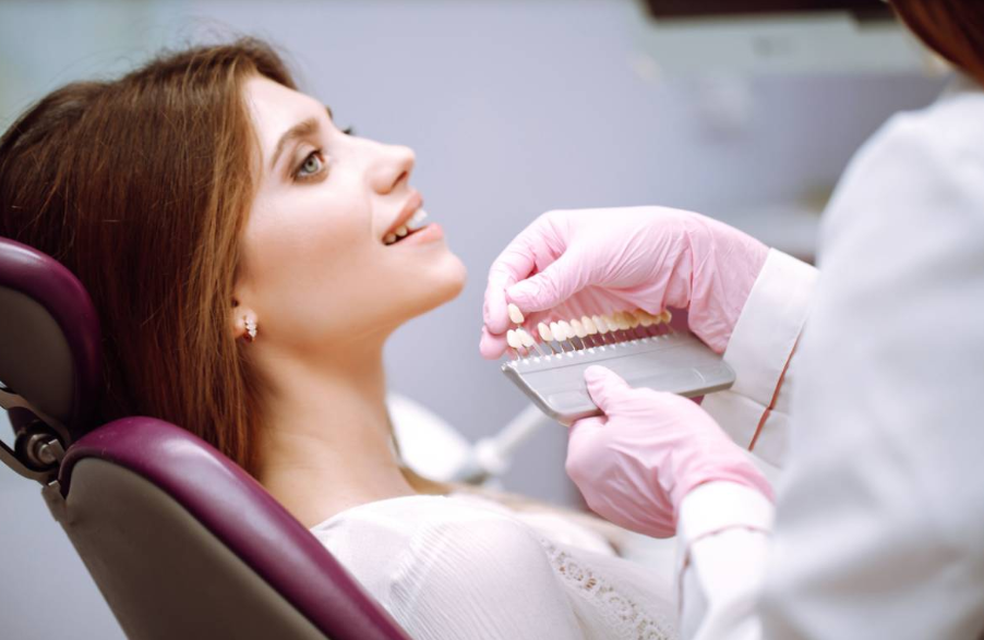 How should lower dentures fit?