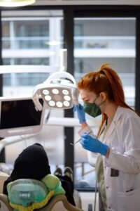 Dentist explaining tooth replacement options to a patient at a Woodbridge dental clinic