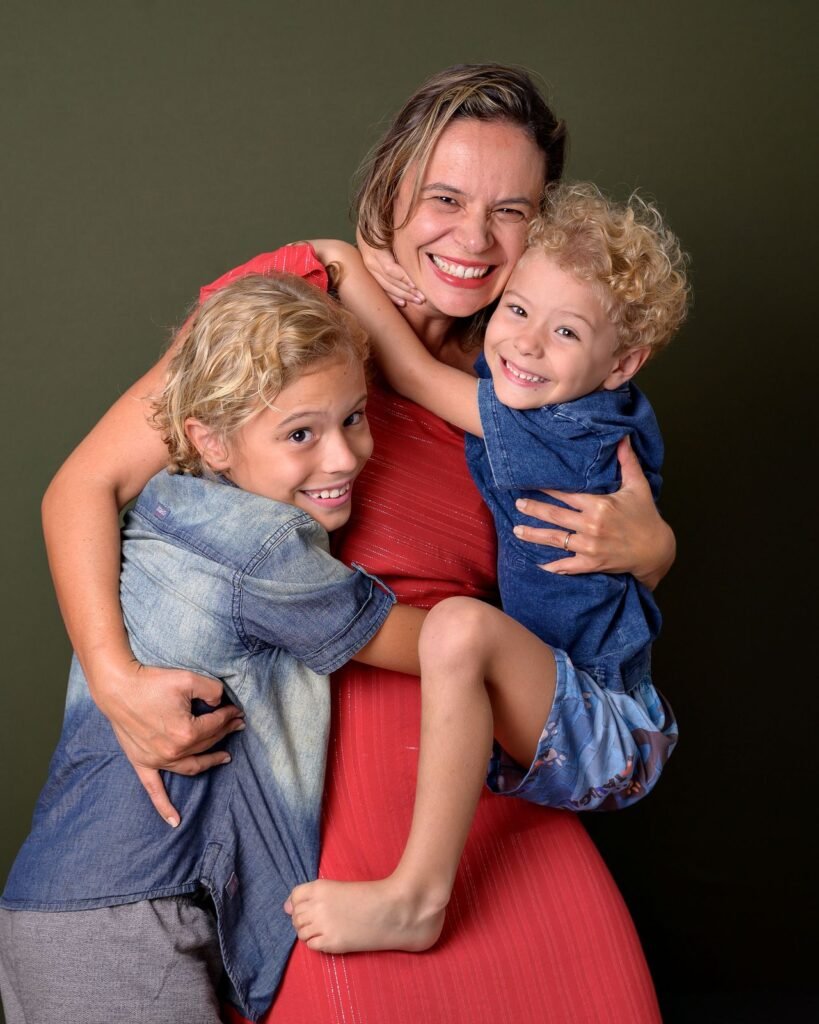 Mother embracing her smiling child during a family dental conversation in Woodbridge