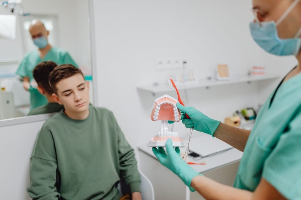 Young patient learning about orthodontic care and braces at a Woodbridge dental clinic