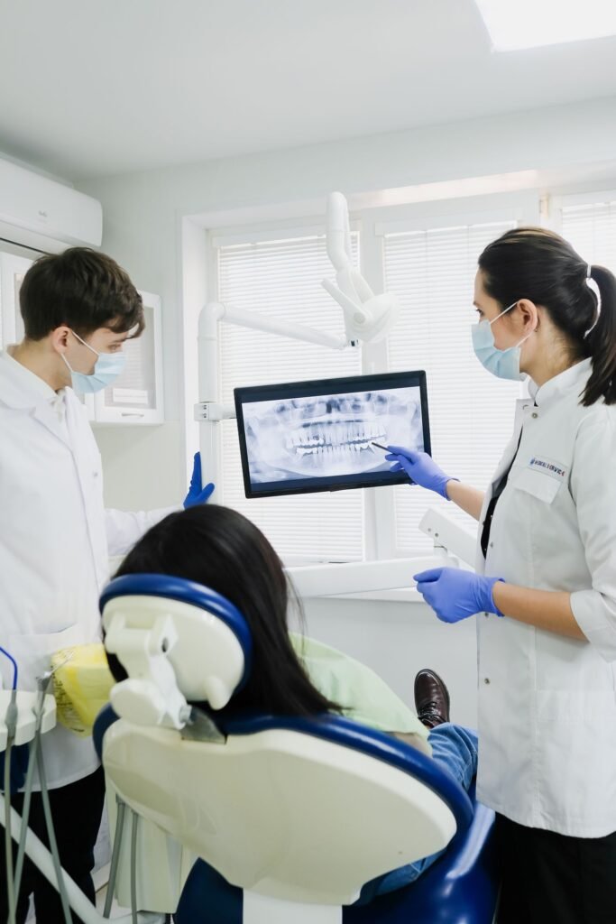 Dentists in Woodbridge reviewing an X-ray to plan dental implants