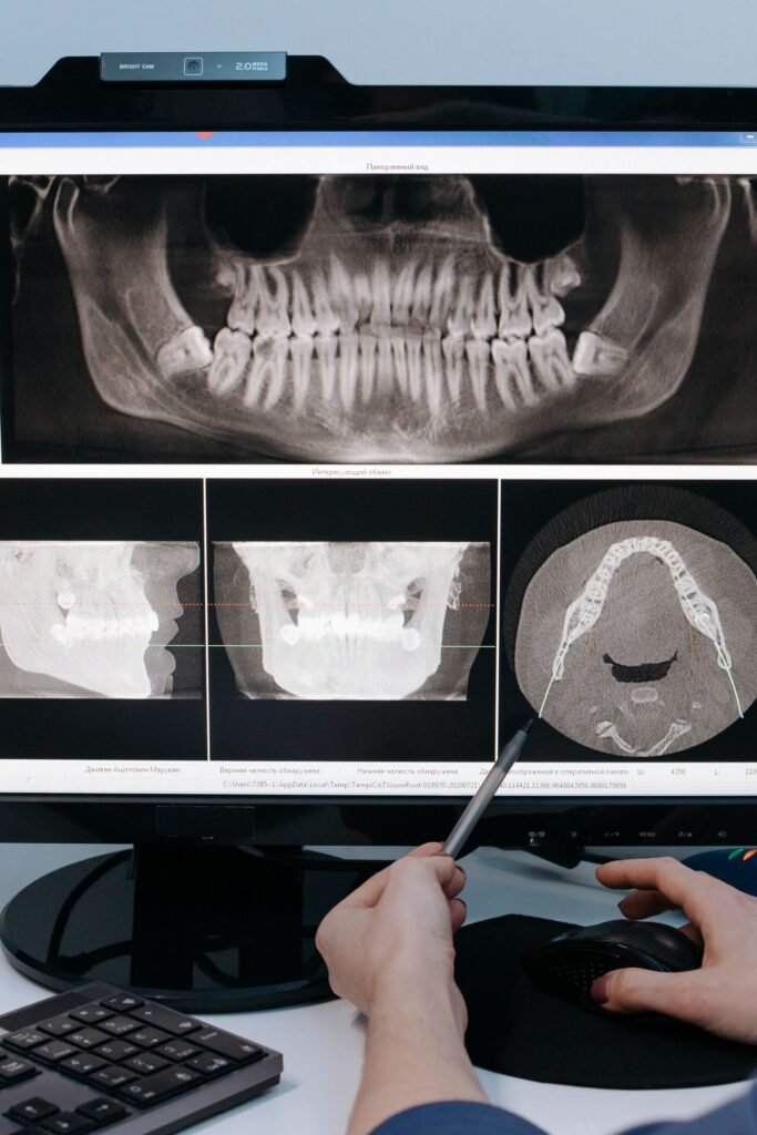 Dental professional examining an X-ray before placing a crown