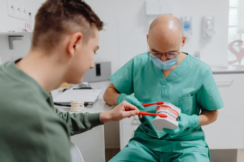 Dentist in Woodbridge showing a patient proper brushing technique