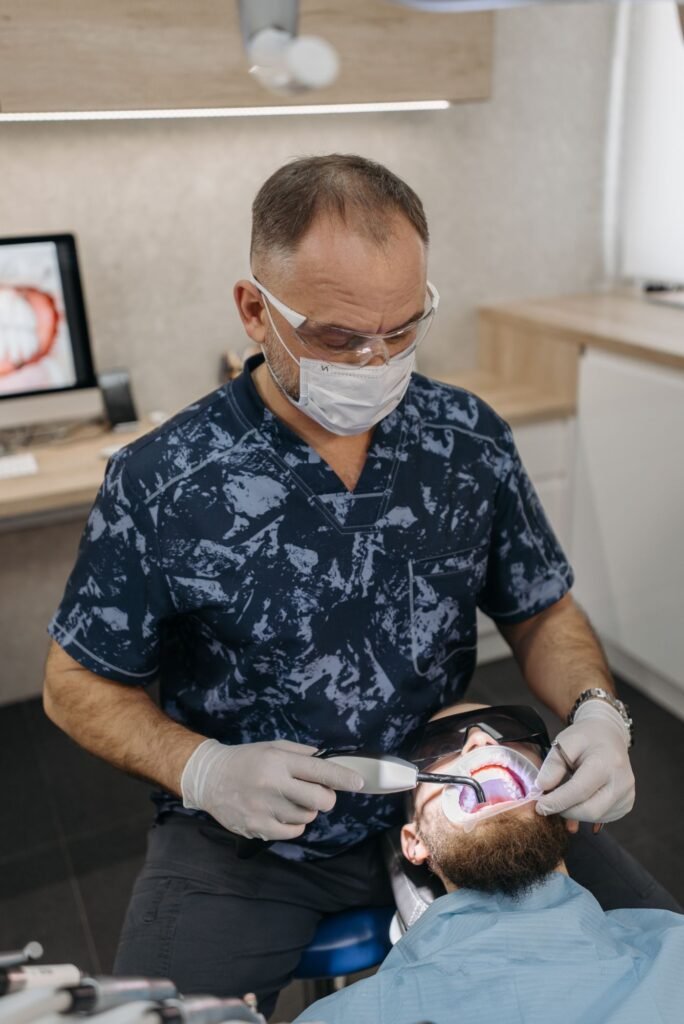 Dentist planning implant-supported treatment with a patient
