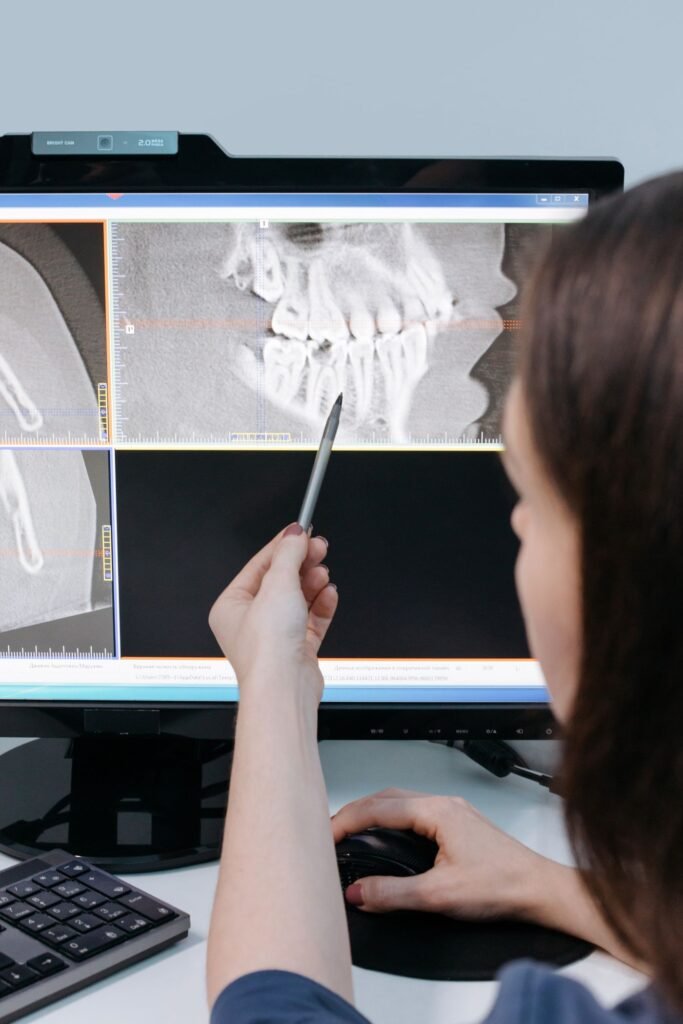 Dentist explaining an X-ray before recommending a dental crown