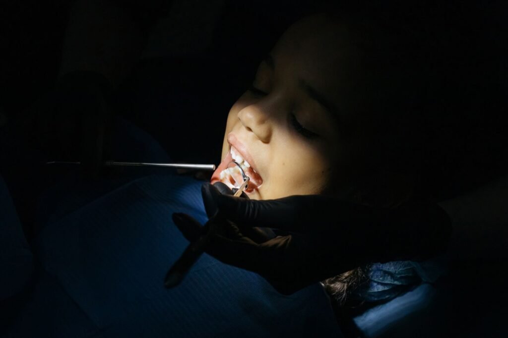 Child at a dental exam for a space maintainer check