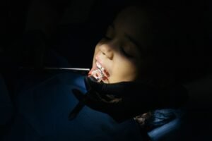 Child at a dental exam for a space maintainer check
