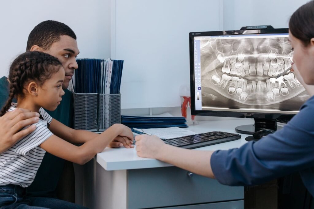 Family dental clinic in Woodbridge: a parent and child talk with a dentist at Peridot Dental Care
