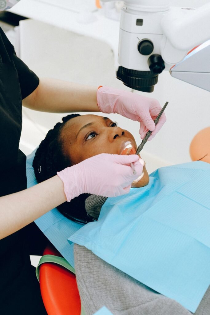 Woman having her teeth examined by a dentist