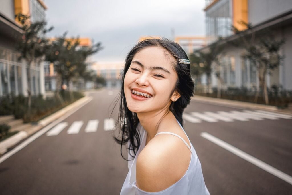 Smiling patient with braces from an orthodontist in Woodbridge