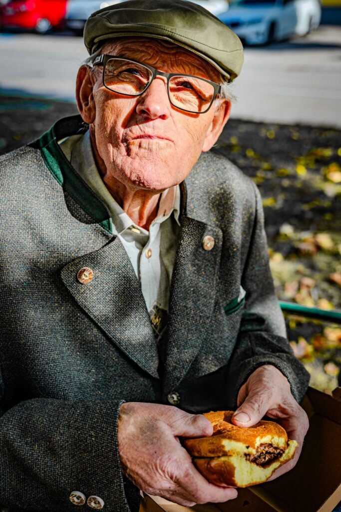 Senior man smiling during recovery after dental implant surgery